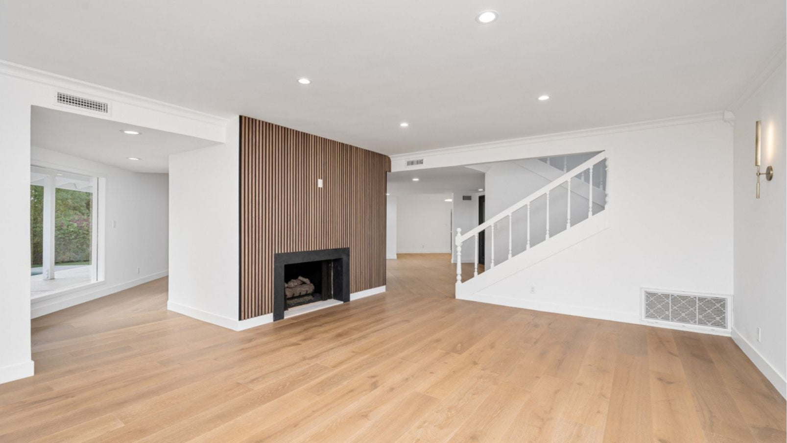 Engineered hardwood floors installed in living room.