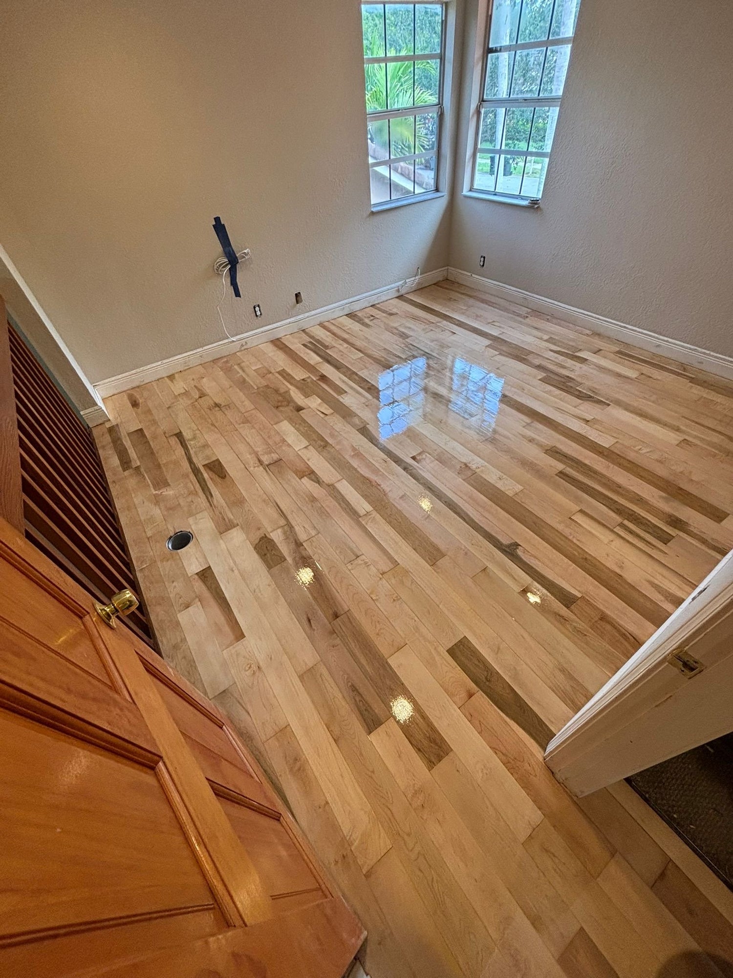Solid Hardwood Floor Refinished and Restored in coconut creek residency
