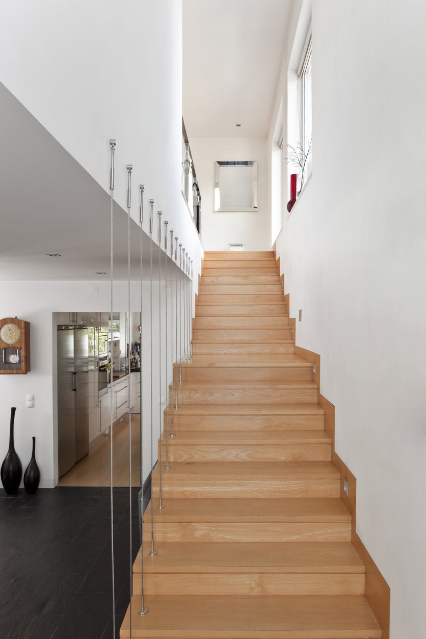 wood stair installation in Coral Gables. Engineered Wood Installed by Florida Hardwood Floors